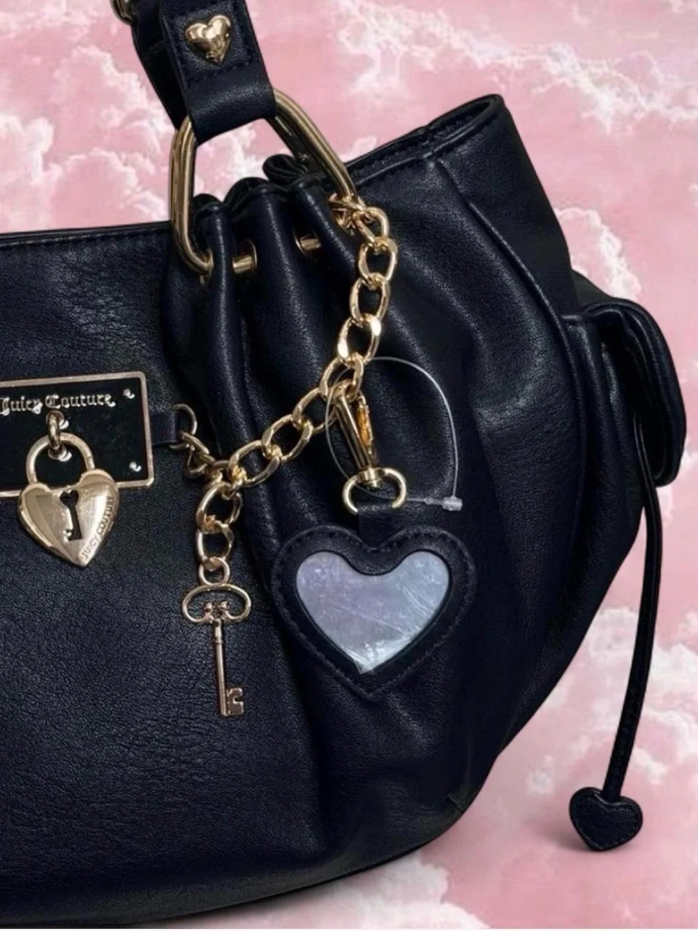 Juicy Couture Rolling On Satchel in the color licorice